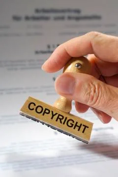 Copyright printed on rubber stamp Stock Photos