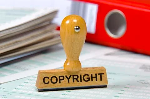 Copyright printed on rubber stamp Stock Photos