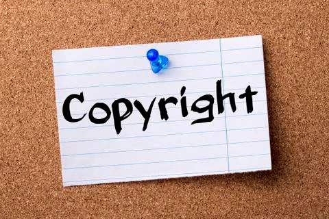 Copyright - teared note paper pinned on bulletin board Stock Photos