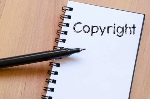 Copyright write on notebook Stock Photos