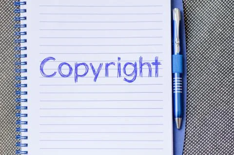 Copyright write on notebook Stock Photos