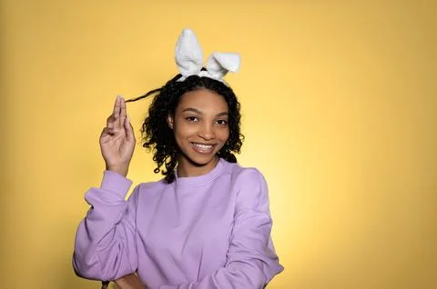 Copyspace easter banner with dark skinned happy smiling model looking at the Stock Photos