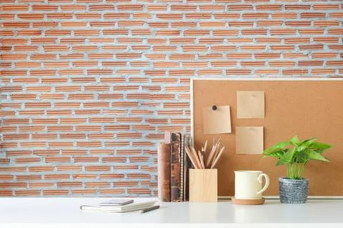 Copyspace of office equipment on white table with stone wall texture backgr.. Stock-Fotos