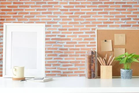 Copyspace of office equipment on white table with stone wall texture backgr.. Stock-Fotos