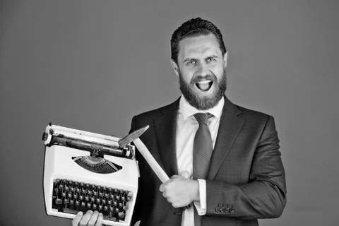 Copywriting errors. business man, aggressive businessman with typewriter and Stockfoto's