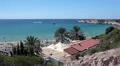 Coral Bay Resort with peninsulas both sides of a sandy beach, Paphos, Cyprus HD Footage