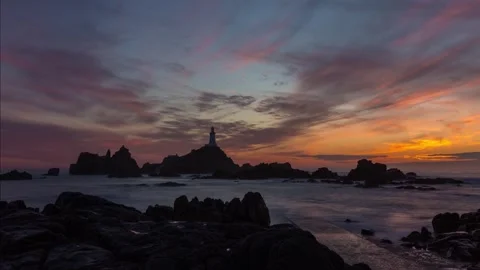 Corbiere lighthouse in Jersey at sunset 4k Time Lapse Video stock 253503433