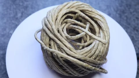 Cord rolled up into a ball 動画素材 312267520