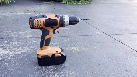 Cordless drill on concrete surface Stock Footage 321228239