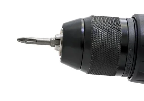 Cordless drill with drill bit working also as screw gun. 写真素材