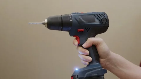 Cordless drill in hand ready for work Stock Footage 329184582