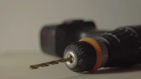 Cordless electric drill being picked up in close up slow motion Video stock 103131110