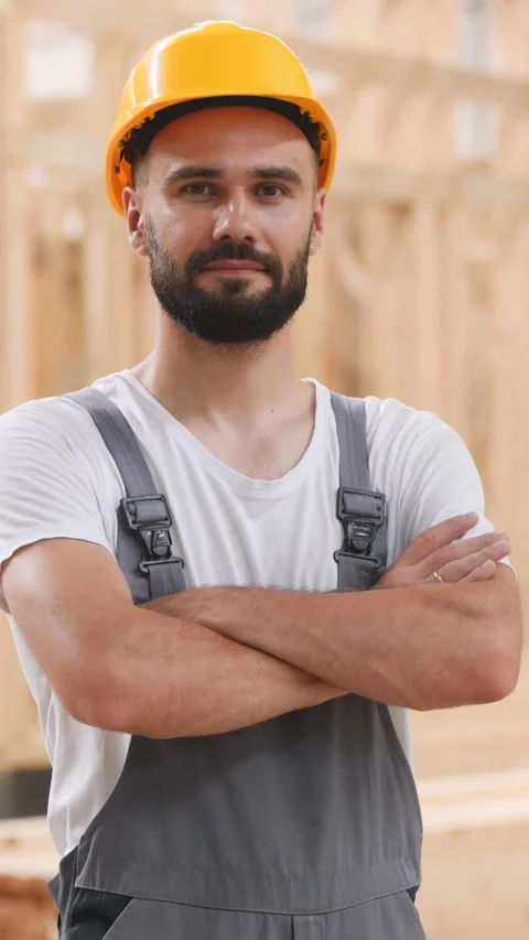 Cordless impact driver in hand. Industrial worker in wooden warehouse Stock Footage 296163353