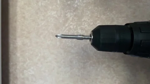 Cordless power screwdriver running at speed, metal bit rotating for home re.. Stock Footage 329916688