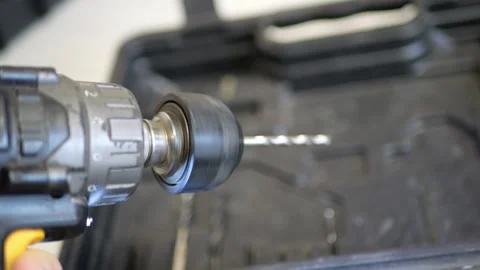 Cordless Screwdriver Activating with Loud Reverse Rotation and Spinning Drill Stock Footage 321526579