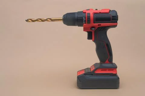 A cordless screwdriver with a drill bit. close-up Stock Photos