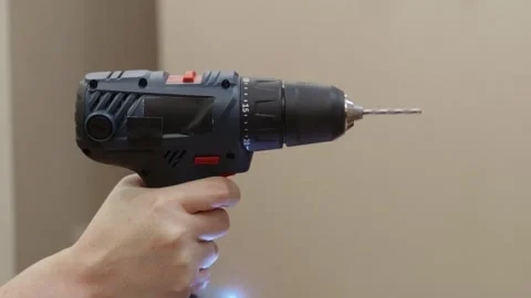 Cordless screwdriver rotating drill bit closeup indoors Stock Footage 329184632