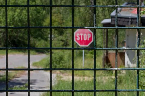 Cordoned off path in the forest with a stop sign Stock Photos