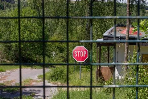 Cordoned off path in the forest with a stop sign Stock Photos