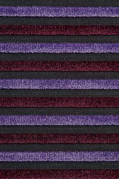 Corduroy background with lines pattern close up. Texture of violet corduroy Stockfoto's