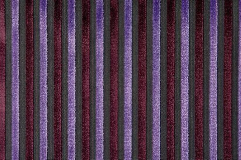 Corduroy background with lines pattern close up. Texture of violet corduroy Stock Photos