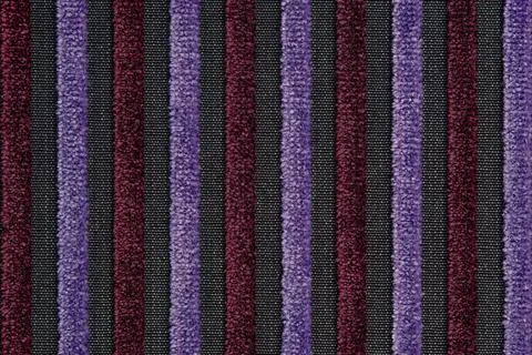 Corduroy background with lines pattern close up. Texture of violet corduroy Stock Photos