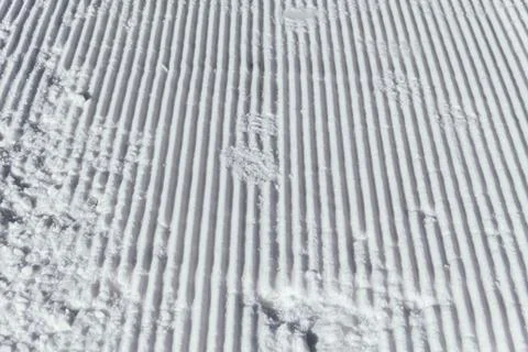 A corduroy is the name given to the path created by a snowplow on a slope. .. Stock Photos