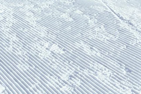 A corduroy is the name given to the path created by a snowplow on a slope. .. Stock Photos
