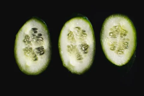 The core of the cucumber on black Stock Photos