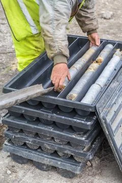 Core drill worker extracts core samples Stock Photos