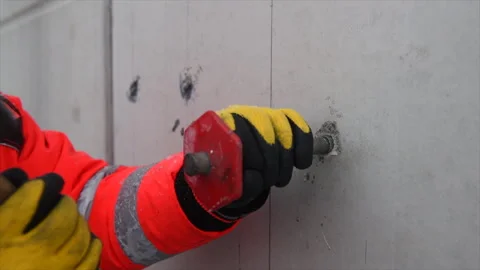 Core Driller Anchor Installation Into a concrete wall with hammer Stock Footage 271621977