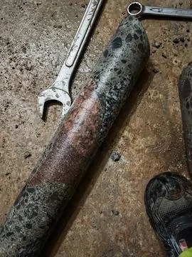 Core drilling sample showing cross section of vintage concrete material.. Stock Photos