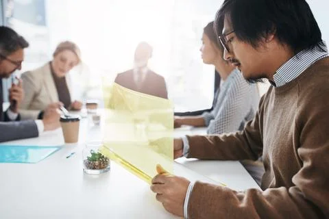 The core of every business is a committed team. a group of businesspeople having Stock Photos