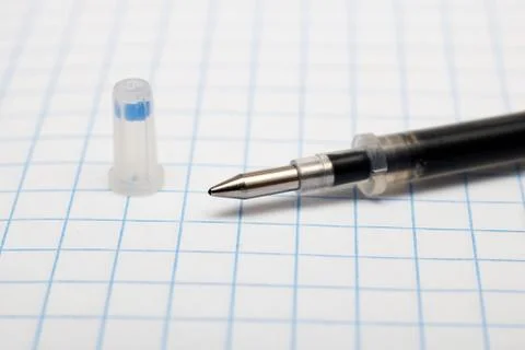 The core for a pen on the background of notebook Stock Photos