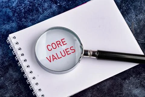 CORE VALUES. ethics concept, text through a magnifying glass in a notebook on Foto stock