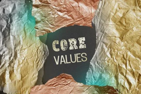 Core Values written behind torn foil paper. Business ethics concept Stock Photos