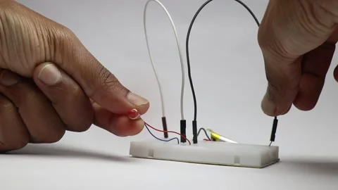 Coreless motor also called as mini drone motor connected to lithium polymer Stock Footage 327978415