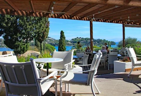 CORFU, GREECE - OCTOBER 5TH 2012: Covered bar area of holiday hotel with wond Stock Photos