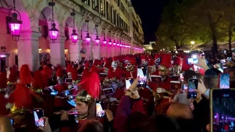 Corfu Town Easter Procession: Philharmonic Band in Red Uniforms with Large Stock Footage 334786842