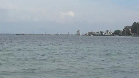 Corfu, view of the windmill from afar from the shore Video stock 307383791