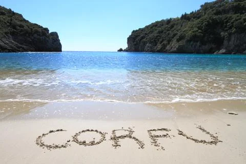 Corfu written on sandy beach Stock Photos