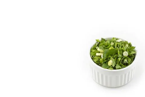 Coriander in ramekin isolated on white background. Stock Photos
