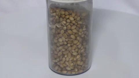 Coriander seeds in packed one container and movin Stock Footage 111887933