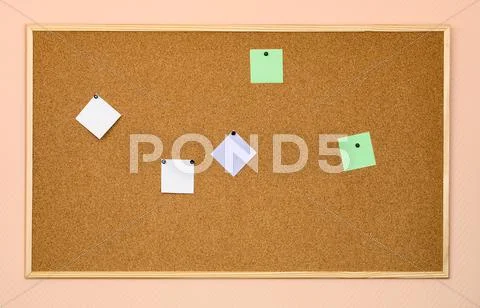Cork billboard on an office wall Stock Photos