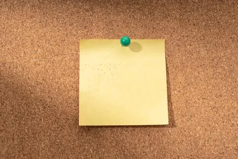 Cork board with blank yellow note for adding text. Mock up Stock Photos