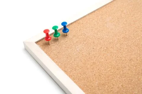 Cork board with post it and push pins and wooden frame on white background wi Stock Photos