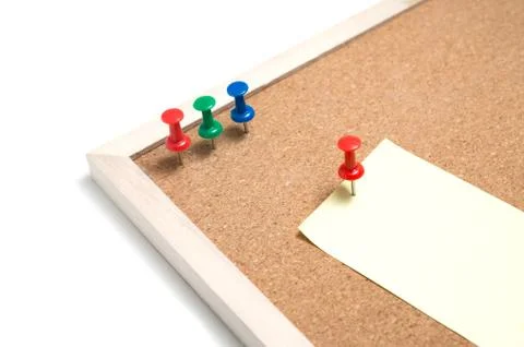 Cork board with post it and push pins and wooden frame on white background wi Stock Photos