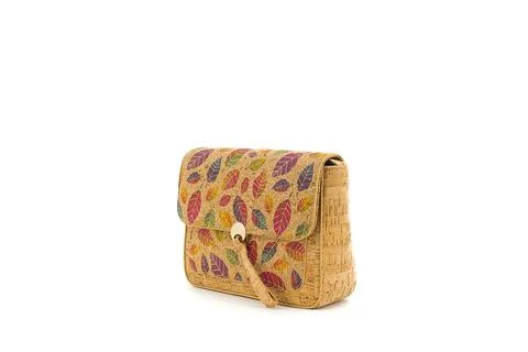 Cork handbag with intricate pattern and a modern curved shape. Stock Photos