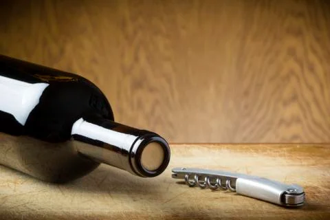 Corkscrew and bottle of wine Foto stock