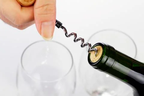 Corkscrew and wine bottle Stock Photos